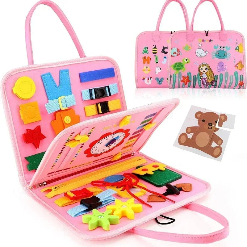 Pink sensory activity busy board bag for kids with zippers, buckles, and learning tools